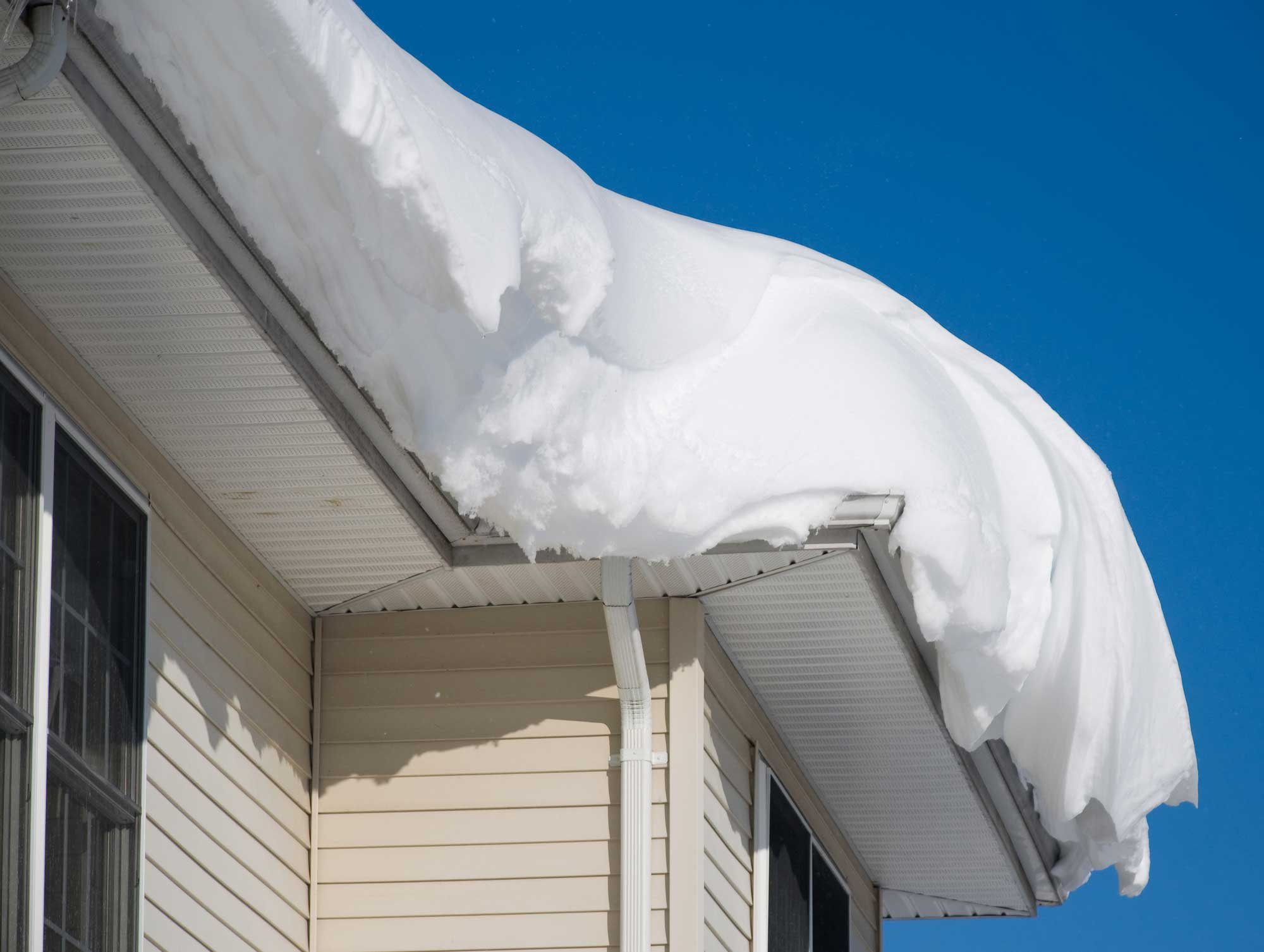 The Dangers of Ice Dams for Your Burnsville Roof