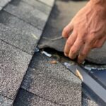 man inspecting roof