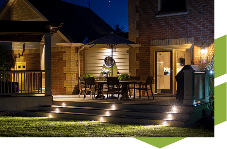 Back deck with lit stairs
